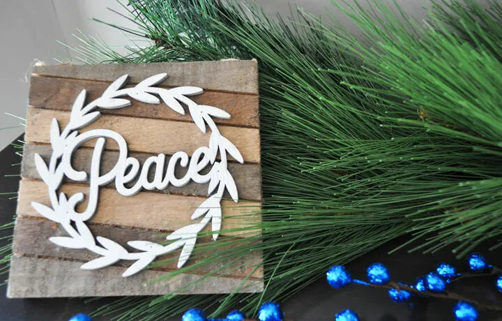 save money for Christmas peace sign with Christmas decor