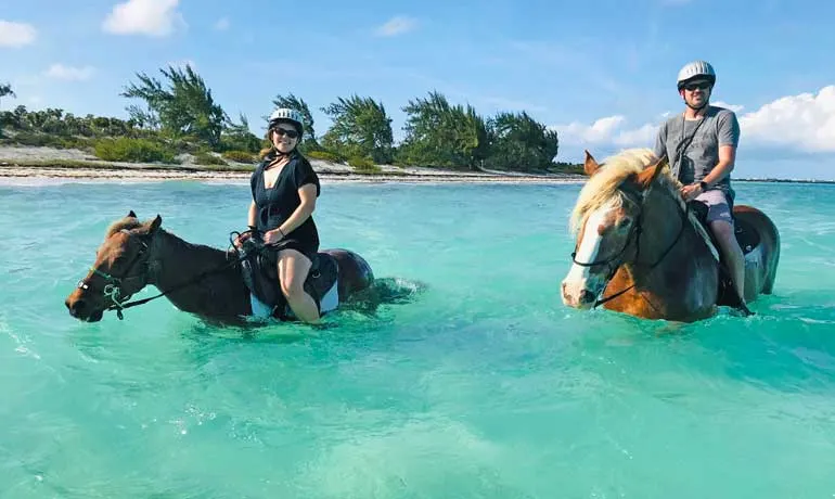 Travel couple horseback riding turks and caicos