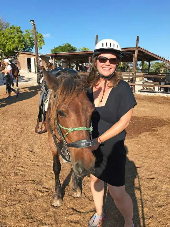 finishing up horseback riding in the ocean, Nikki and Patches the horse