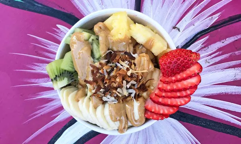 maui acai bowl with fruit, peanut butter and coconut