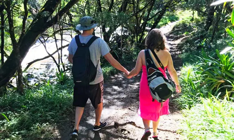 couple hiking in Maui twin falls