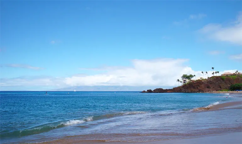 Kaanapali beach overlooking black rock with blue sky