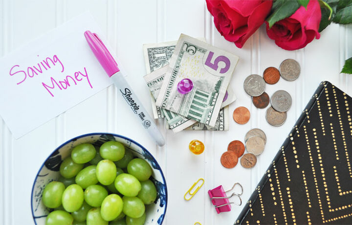 how to budget and save money view of cash grapes pen notebook