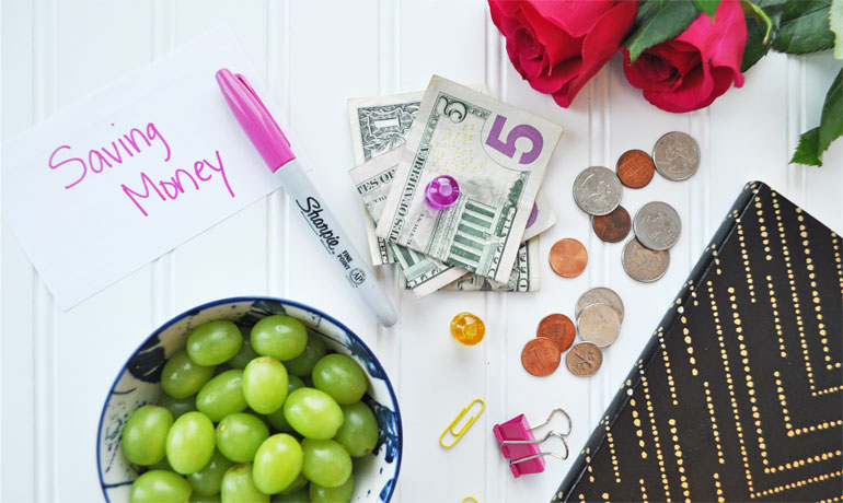 how to budget and save money view of cash grapes pen notebook