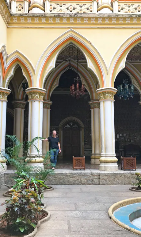 standing in a doorway of the Bangalore Palace