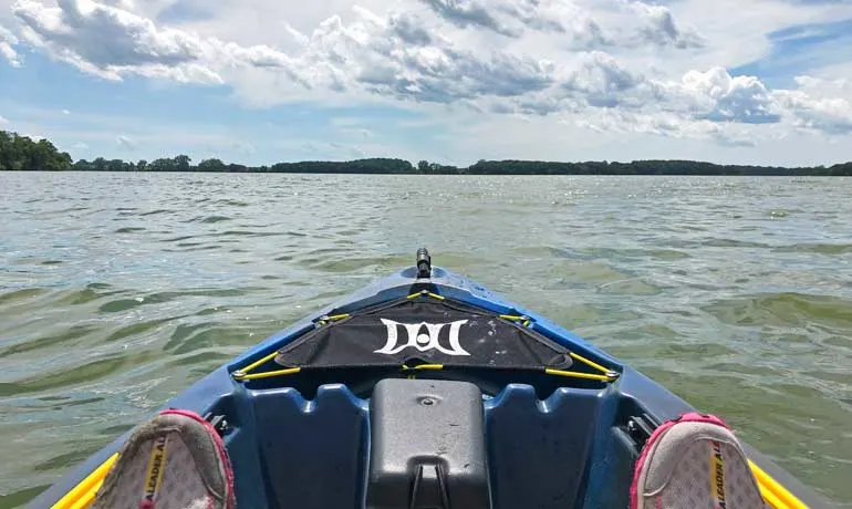 kayaking on a lake near estherville front of kayak on lake