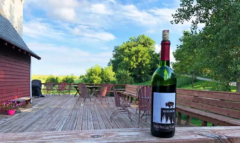 little swan lake winery bottle and outdoor deck