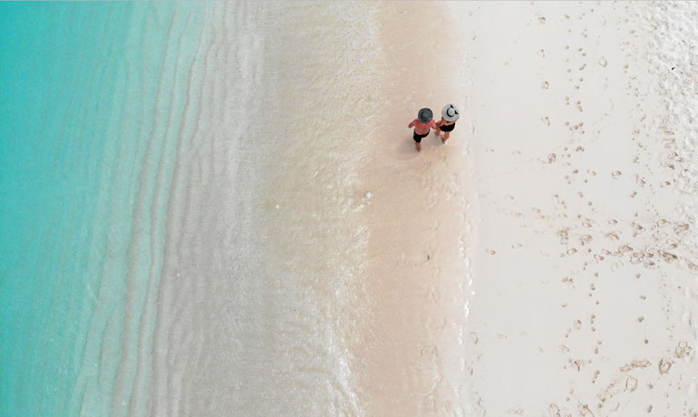 white sand of turks and caicos walking on beach