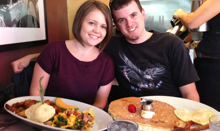 eating at Hash House a Go Go in San Diego with huge breakfast plates