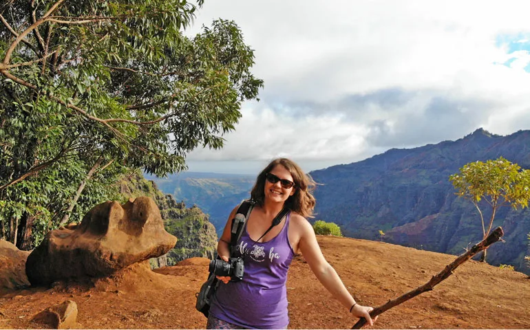 Hiking Waimea Canyon with canyon in background