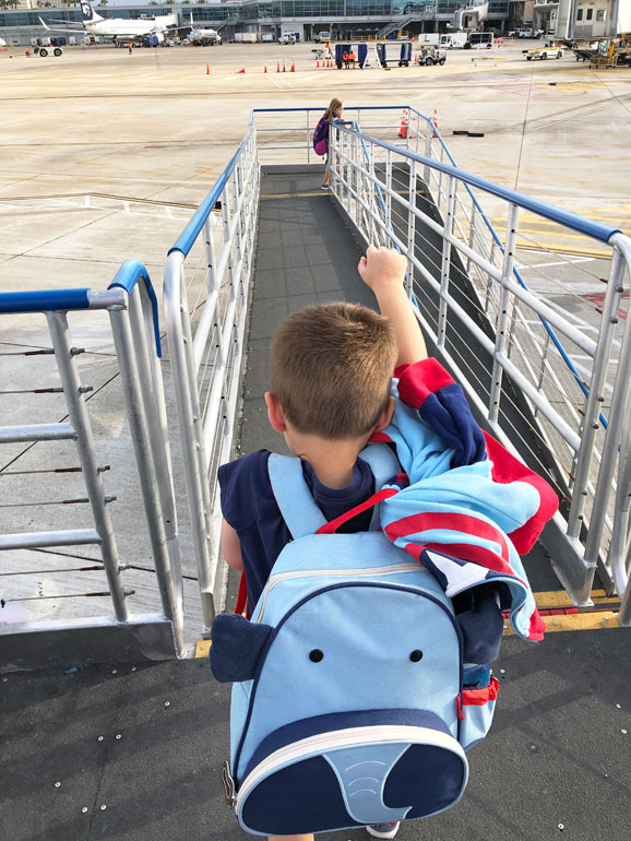 celebrating kids first flight on tarmac