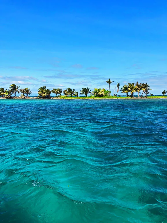 turquoise waters of Belize with island in background