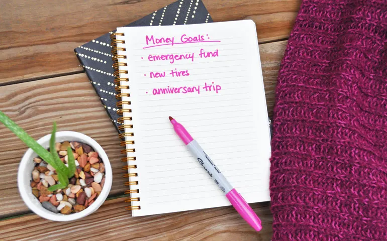 money goals emergency fund during coronavirus on notebook