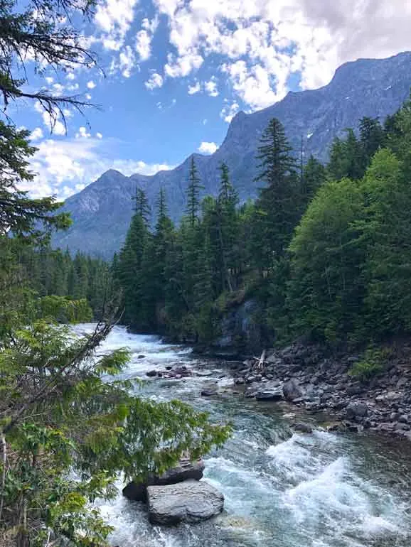 mcdonald falls glacier np with mountains in background