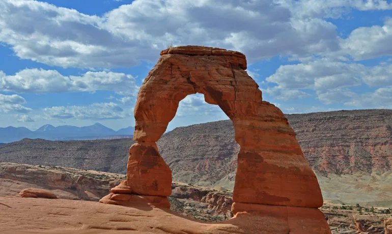 traveling to Utah view of delicate arch from a distance