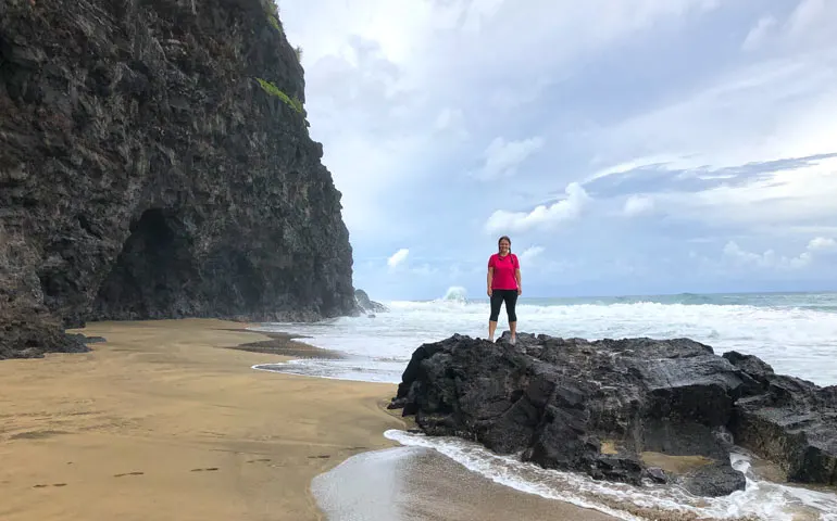 hanakapiai beach standing on rock