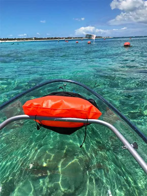kayak in thecaribbean with glass bottom kayak and teal water underneath