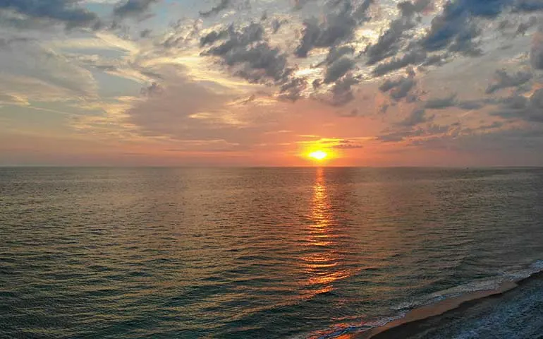 gulf coast sunset sun and water