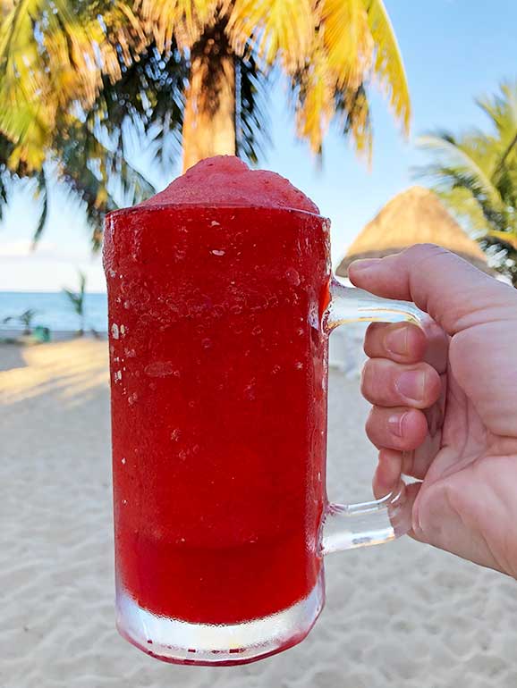 having a frozen cocktail on the beach
