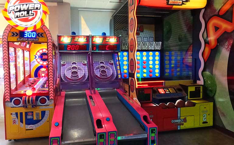 classic arcade games skee ball, basket ball and power roll