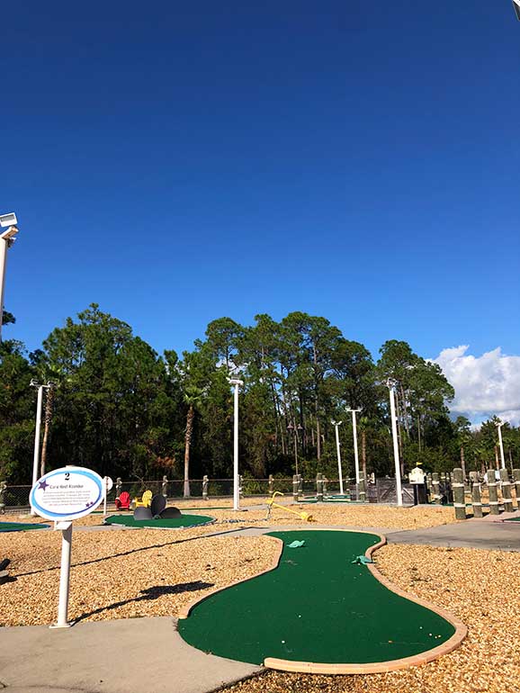 mini golf course at the wharf orange beach including a small golf area and trees
