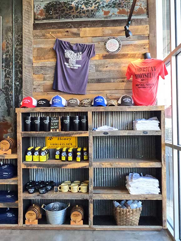 shopping at the wharf shelf with hats, shirts, cups, etc