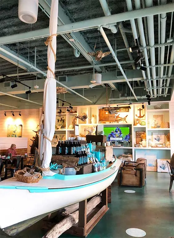 places to see in orange beach - photo includes interior of coffee house including a boat and merchandise