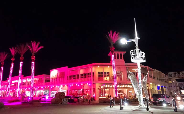 the wharf at orange beach light show Main Street light up in pink
