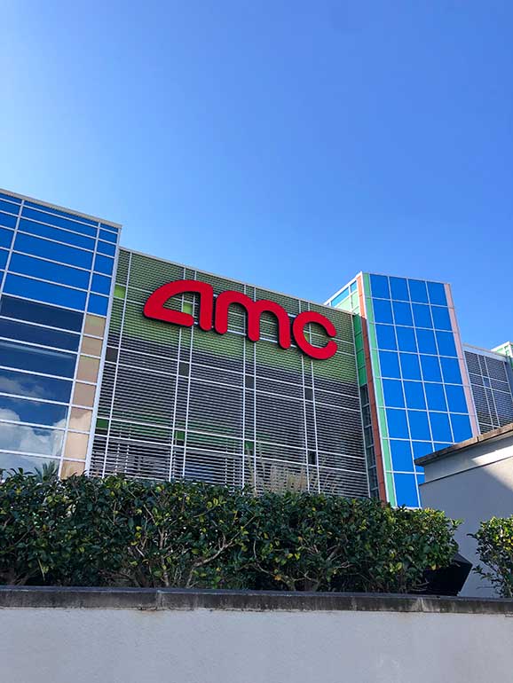 AMC sign and building front at the wharf orange beach