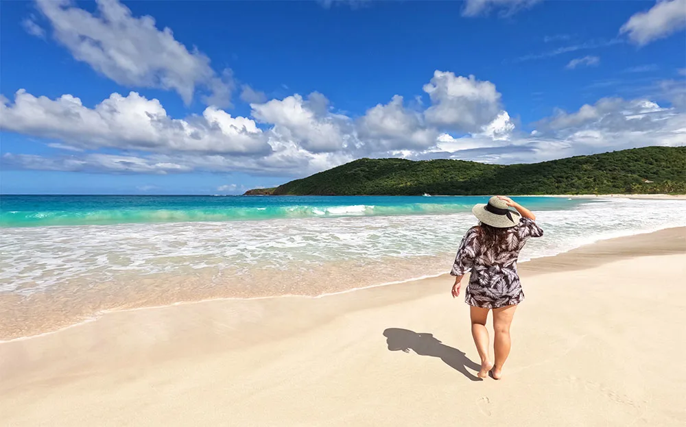 woman walking on flamenco beach Culebra Puerto rico