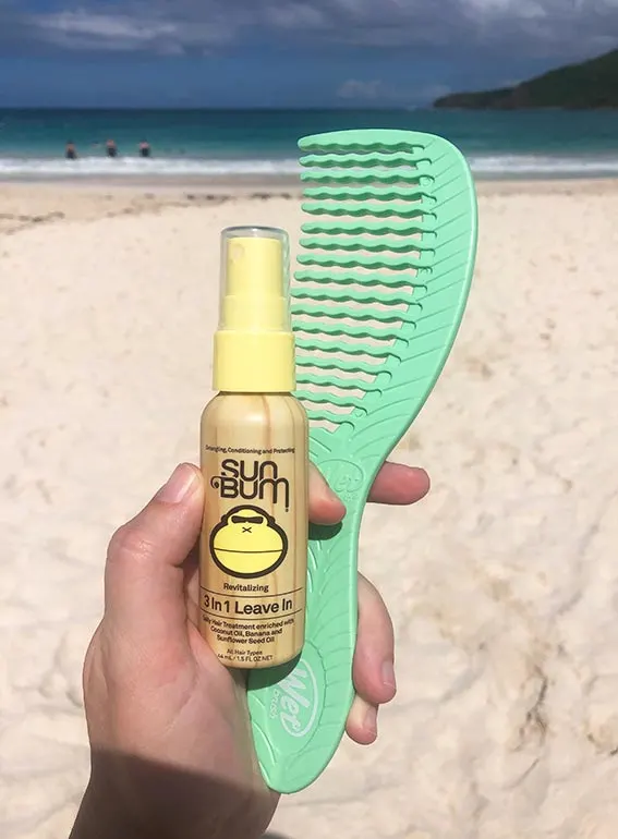 sun bum and comb with beach in background what to pack for flamenco beach