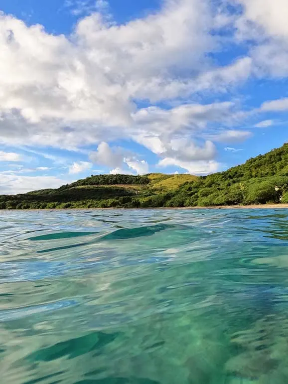 Tamarindo beach culebra snorkeling view form the water of hillside coast