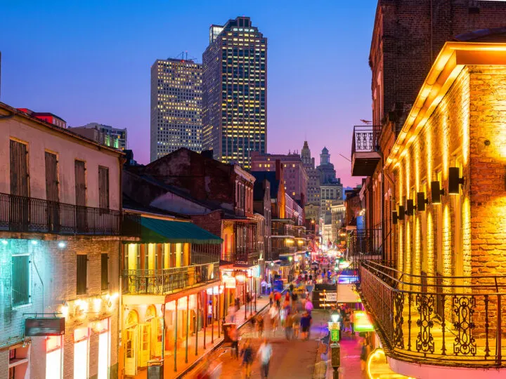 city streets of New Orleans at night with blurred people and lights