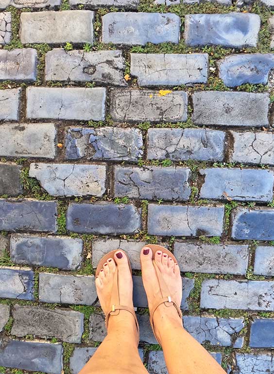 blue cobblestone streets old San Juan with woman's feet