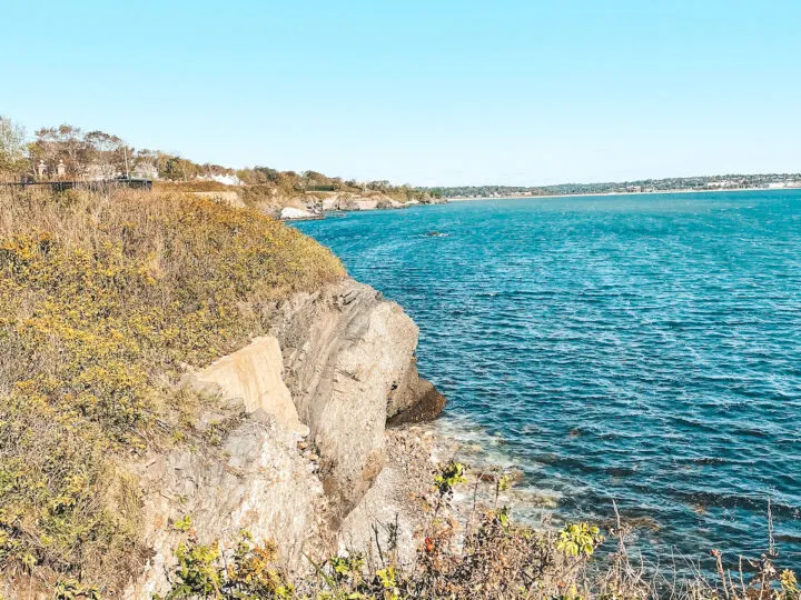 underrated honeymoon spots cliffs of Rhode Island with blue water and fall foliage