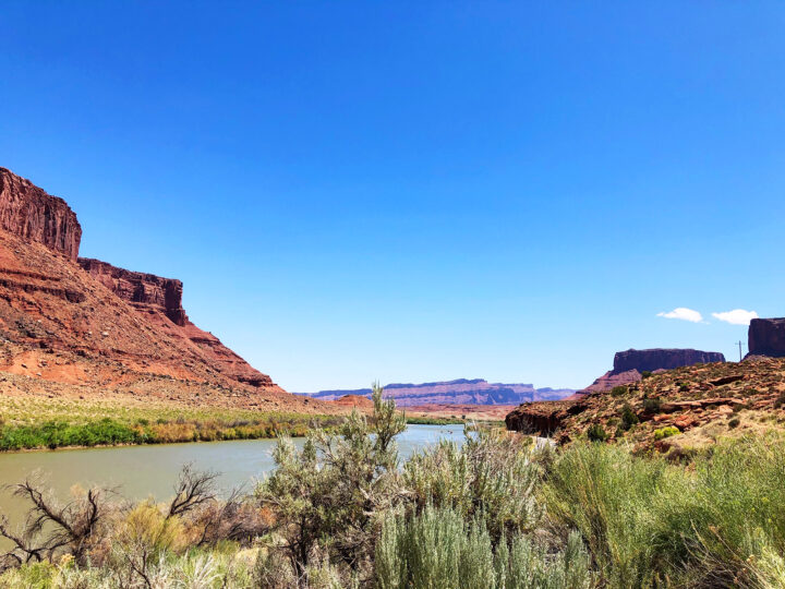 scenic desert views with colorful cliffs and river