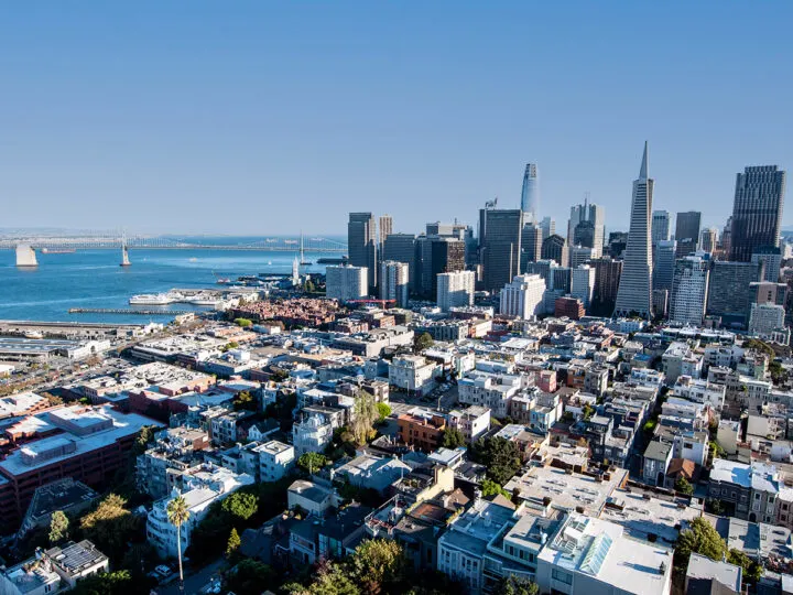 view of San Francisco city buildings with bay and bridge in background