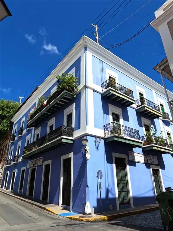adorable building blue and white with balconies on a sunny day