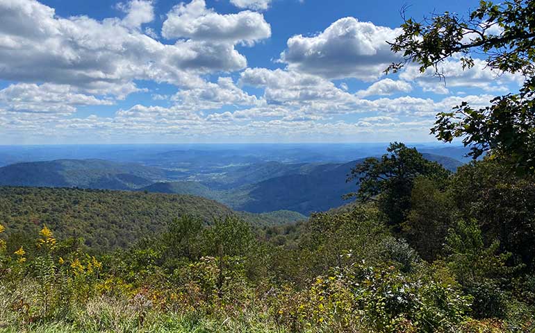 Shenandoah national parks best parks to visit in April on a sunny day with mountains in background and greenery foreground