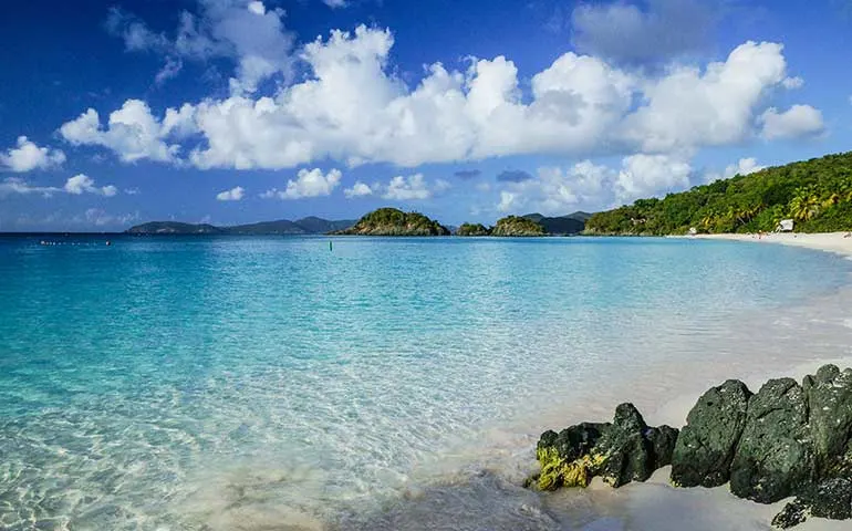 Virgin Islands national park beach with turquoise water hills in background