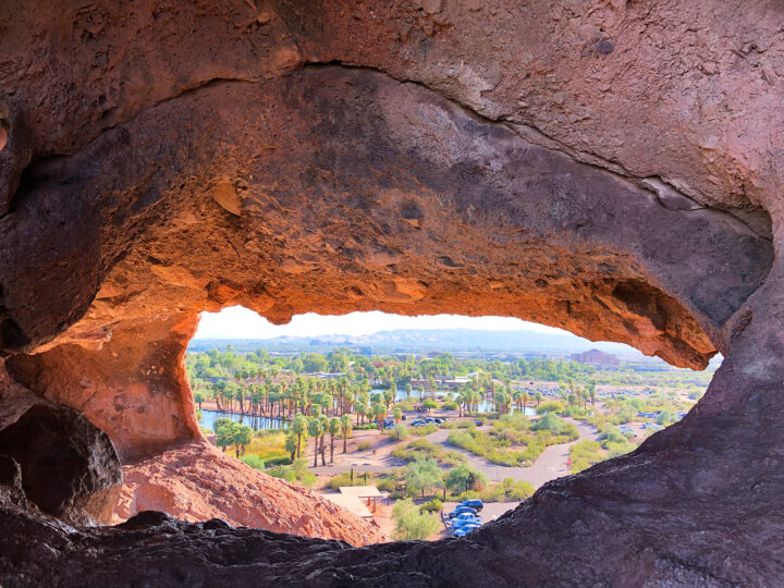 hole in rock phoenix, view from inside rock hole looking at palm trees and parking lot