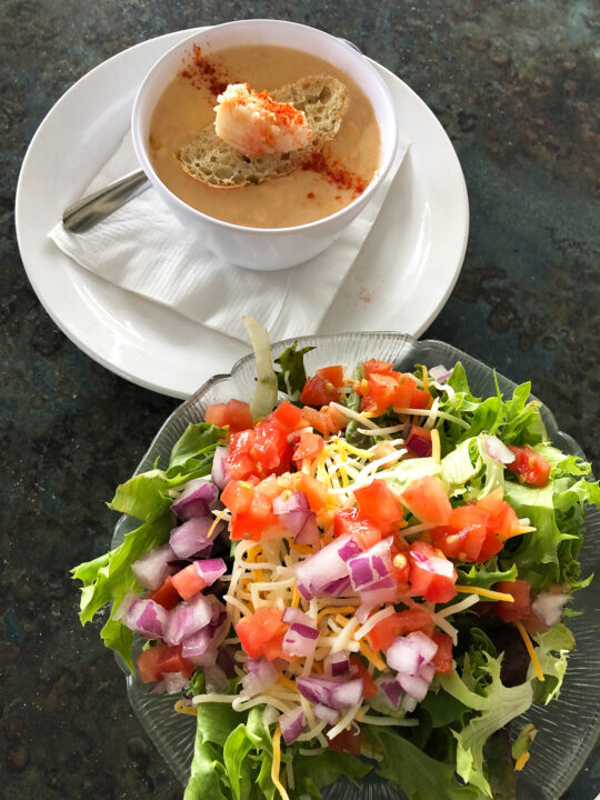 picture of soup and salad at restaurant table