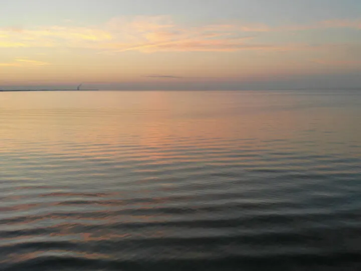 Lake Erie Ohio sunset pink purple and blue sky with reflective lake surface