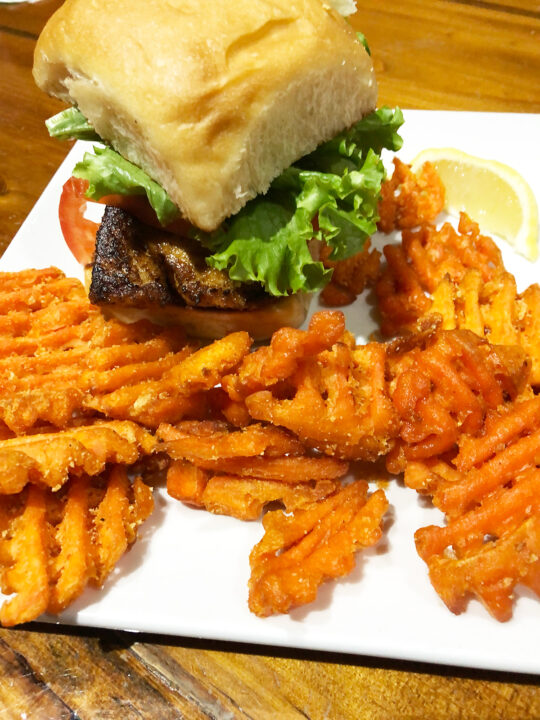 best orange beach restaurants photo of mahi mahi sandwich with sweet potato fries