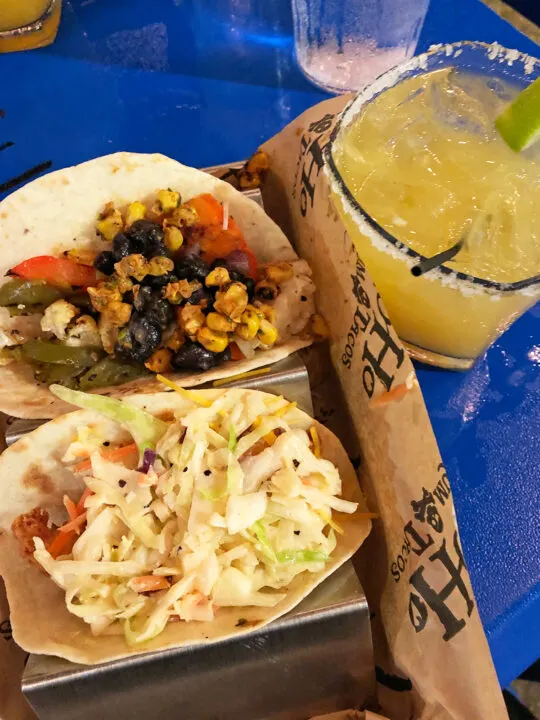YoHo rum and tacos orange beach restaurants on the water photo of tacos with margarita on blue table