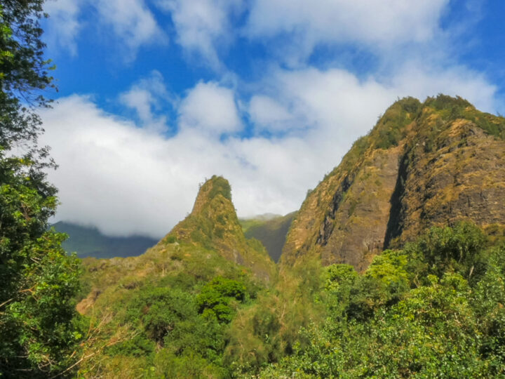 Iao Valley Needle large grassy rock sticking up in valley on partly cloudy day