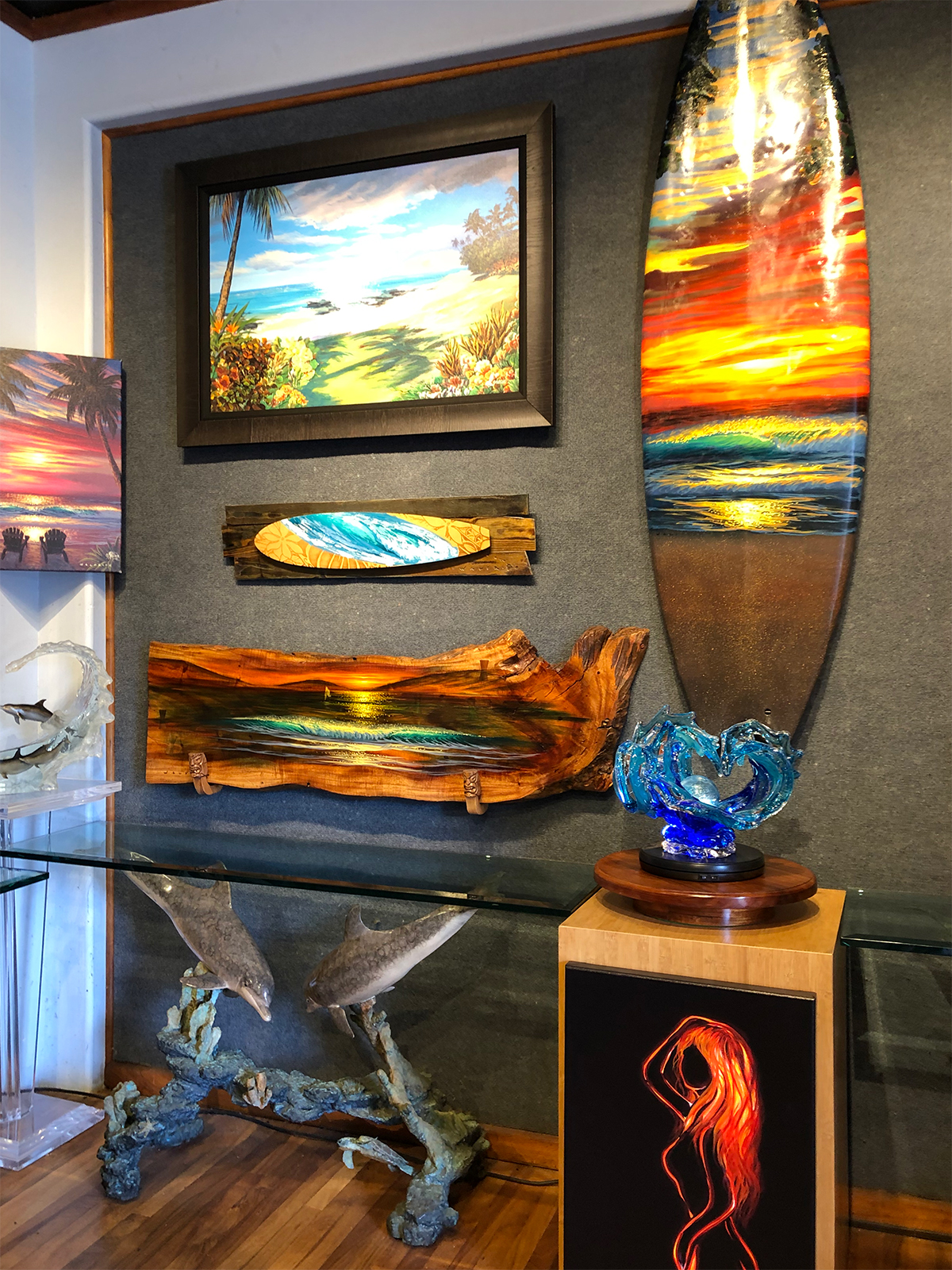 art gallery with paintings painted wood and surfboard