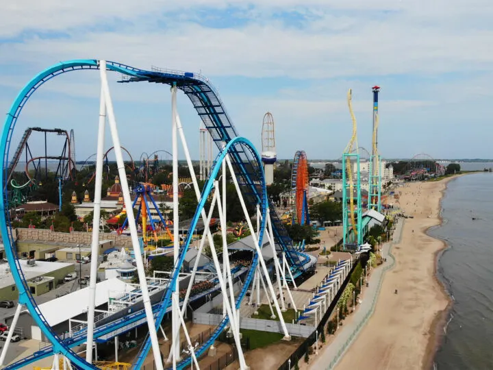 view of amusement park from the air colorful roller coasters and sandy beach
