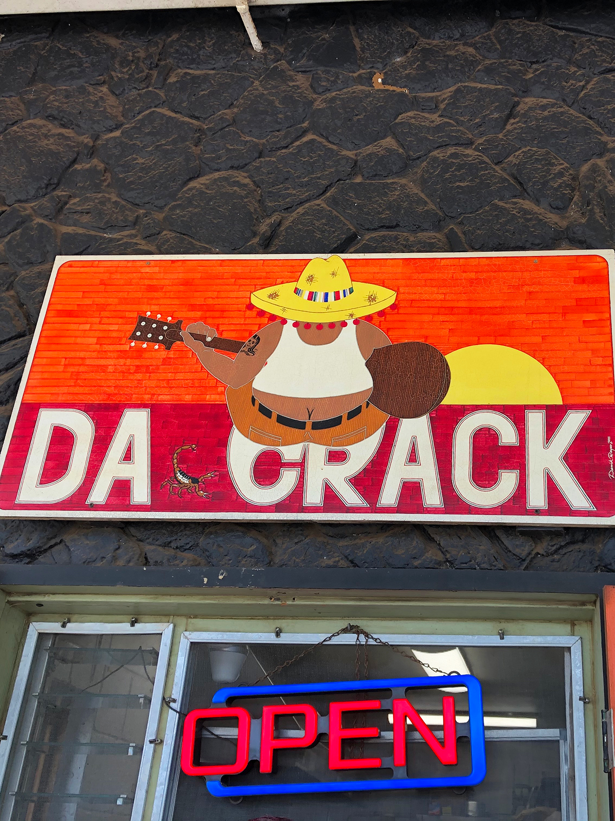 da crack sign with man and sombrero with open sign below