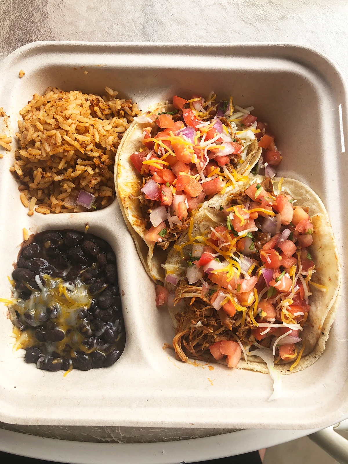 kauai restaurants mexican food with rice beans cheese and two tacos
